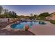 Large freeform pool with a waterfall and plenty of lounge space at 12832 E Sorrel Ln, Scottsdale, AZ 85259