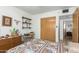 Bedroom with built-in shelves and dresser at 1522 W Puget Ave, Phoenix, AZ 85021