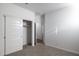 Bedroom with closet and door to bathroom at 17740 W Mission Ln, Waddell, AZ 85355