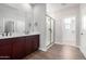 Elegant bathroom with double vanity and a glass shower at 19743 W Exeter Blvd, Buckeye, AZ 85340
