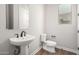 Simple and clean bathroom with pedestal sink and updated fixtures at 19743 W Exeter Blvd, Buckeye, AZ 85340