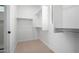 Ample closet space with hanging rods and shelving at 19743 W Exeter Blvd, Buckeye, AZ 85340