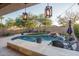 Relaxing pool area with patio furniture and lighting at 2301 E Parkside Ln, Phoenix, AZ 85024