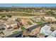 Aerial view of luxury homes and farmland with mountain backdrop at 2326 N Sinagua Cir, Mesa, AZ 85203