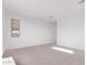 Well-lit bedroom featuring carpet and a window with natural light at 24478 N 140Th Ave, Surprise, AZ 85387