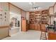 Home office with built-in shelves and wood desk at 26606 S Foxglenn Dr, Sun Lakes, AZ 85248