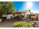 Spacious backyard with covered patio, pool, and mature trees at 4442 E Walatowa St, Phoenix, AZ 85044