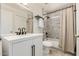 Updated bathroom with white vanity, gray tile, and bathtub at 4442 E Walatowa St, Phoenix, AZ 85044