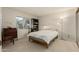 Bright bedroom with double bed, built-in shelving, and window overlooking backyard at 4442 E Walatowa St, Phoenix, AZ 85044