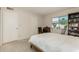 Well-lit bedroom featuring a double bed, bookcase, and ample closet space at 4442 E Walatowa St, Phoenix, AZ 85044