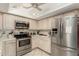 Bright kitchen featuring stainless steel appliances and light wood cabinets at 4442 E Walatowa St, Phoenix, AZ 85044