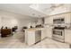 Eat-in kitchen with stainless steel appliances and a breakfast bar at 4442 E Walatowa St, Phoenix, AZ 85044