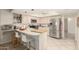 Open kitchen with stainless steel appliances and an island breakfast bar at 4442 E Walatowa St, Phoenix, AZ 85044