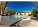 Inviting kidney-shaped pool with pebble tec finish at 4442 E Walatowa St, Phoenix, AZ 85044