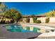Sparkling pool with large patio area and lush landscaping at 4442 E Walatowa St, Phoenix, AZ 85044