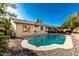 Stunning kidney shaped pool with plenty of patio space for relaxation at 4442 E Walatowa St, Phoenix, AZ 85044