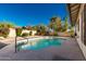 Inviting swimming pool with a concrete deck and surrounding landscaping at 4442 E Walatowa St, Phoenix, AZ 85044