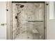 Walk-in shower with marble-style tile and glass door at 4442 E Walatowa St, Phoenix, AZ 85044