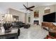 Living room with fireplace, vaulted ceiling, and comfy seating at 5838 E Fox Cir, Mesa, AZ 85205