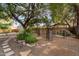 Backyard oasis with gravel, stone path, gazebo, and water feature at 7538 N 17Th Dr, Phoenix, AZ 85021