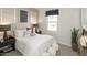 Small bedroom with white bedding, neutral decor, and stylish accents at 8149 E Petunia Ave # 1033, Mesa, AZ 85212