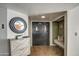 Bright entryway with double doors, tiled floor, and a bench at 8152 W Sierra Vista Dr, Glendale, AZ 85303