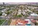 Aerial view of a property with pool, surrounded by palm trees and other homes at 901 W Culver St, Phoenix, AZ 85007