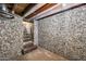 Finished basement with stone feature wall and stairs at 901 W Culver St, Phoenix, AZ 85007