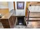 Steps leading down to a finished basement area with tiled floors at 901 W Culver St, Phoenix, AZ 85007
