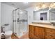 Bathroom features a walk-in shower, wood vanity, and tile floor at 901 W Culver St, Phoenix, AZ 85007