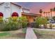 Home's entrance with a stone walkway and lush landscaping at 901 W Culver St, Phoenix, AZ 85007