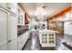 Modern kitchen with white cabinets, granite countertops, and stainless steel appliances at 901 W Culver St, Phoenix, AZ 85007