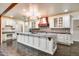 Open kitchen with granite island, stainless steel appliances and custom cabinetry at 901 W Culver St, Phoenix, AZ 85007