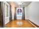 Bright living room with hardwood floors and arched windows at 901 W Culver St, Phoenix, AZ 85007