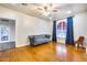 Living room featuring hardwood floors and arched windows at 901 W Culver St, Phoenix, AZ 85007