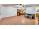 Open living room features tile floors and a kitchen with wood cabinets at 901 W Culver St, Phoenix, AZ 85007