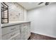 Organized storage room with custom cabinetry and hanging racks at 901 W Culver St, Phoenix, AZ 85007