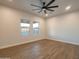 Well-lit bedroom with ceiling fan and two large windows at 955 Calle Azul --, Wickenburg, AZ 85390