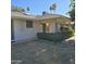 Back patio with lush greenery and a view of the community at 10103 W Forrester Dr, Sun City, AZ 85351