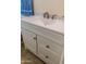 White bathroom vanity with quartz countertop and brushed nickel fixtures at 10103 W Forrester Dr, Sun City, AZ 85351