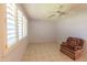 Spacious bedroom featuring tile floors and a ceiling fan at 10103 W Forrester Dr, Sun City, AZ 85351