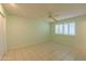 Light green bedroom with ceiling fan and tile floors at 10103 W Forrester Dr, Sun City, AZ 85351