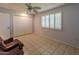 Bedroom with tile flooring, ceiling fan, and large closet at 10103 W Forrester Dr, Sun City, AZ 85351