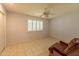 Well-lit bedroom with tile floors and a ceiling fan at 10103 W Forrester Dr, Sun City, AZ 85351