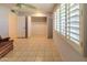 Bedroom with tile flooring, ceiling fan, and large closet at 10103 W Forrester Dr, Sun City, AZ 85351