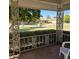 View from covered patio shows lush landscaping and community at 10103 W Forrester Dr, Sun City, AZ 85351