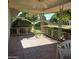 Covered patio with ornate railing and view of the backyard at 10103 W Forrester Dr, Sun City, AZ 85351