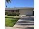 Front view of a single-story home with a beige garage door at 10103 W Forrester Dr, Sun City, AZ 85351