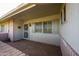 Inviting front porch with tiled flooring and security door at 10103 W Forrester Dr, Sun City, AZ 85351