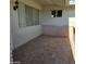 Covered patio with tile flooring and brick accents at 10103 W Forrester Dr, Sun City, AZ 85351